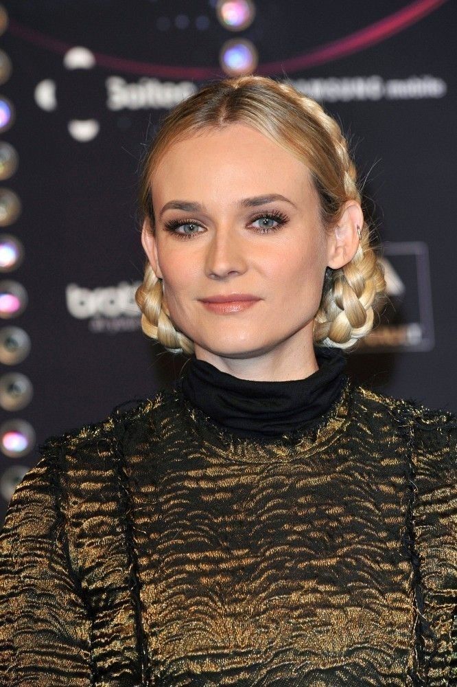Diane Kruger with braided buns wearing Lanvin dress.