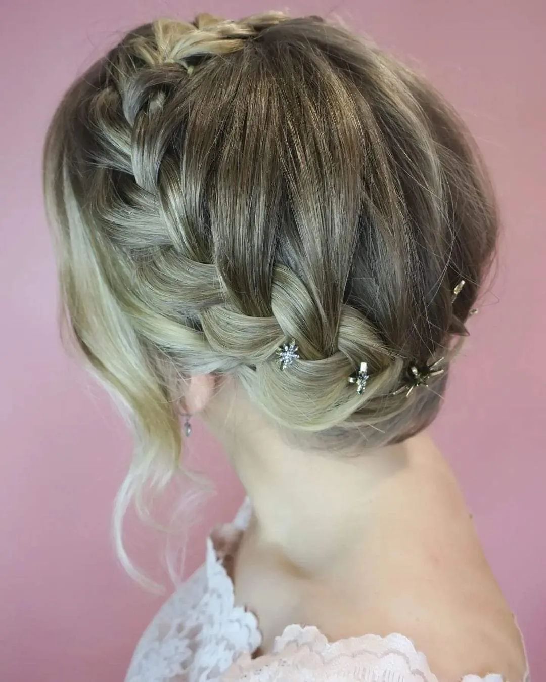 Woman with Halo braid and star bobby pins.
