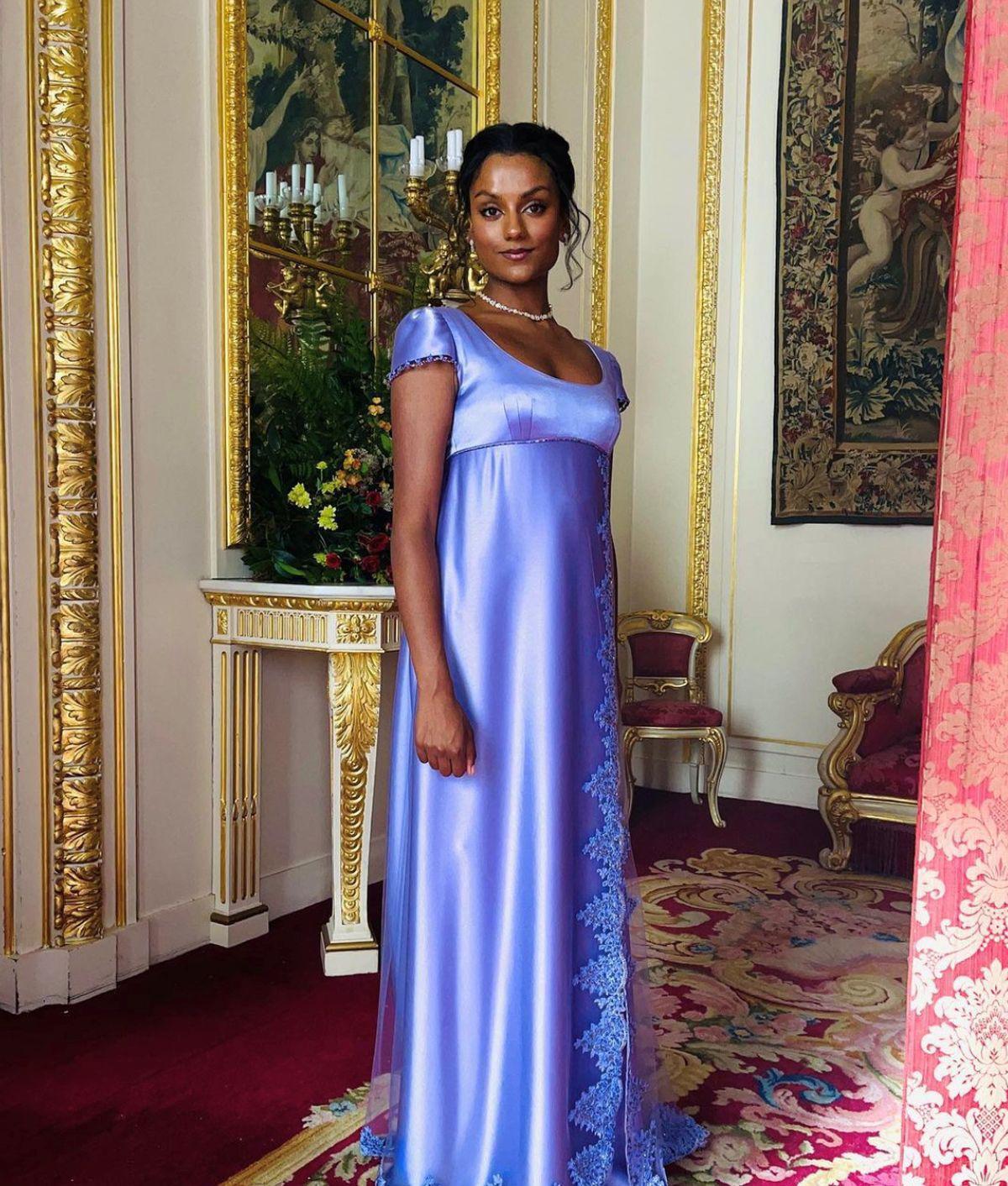 Simone Ashley in a purple dress on the set of Bridgerton