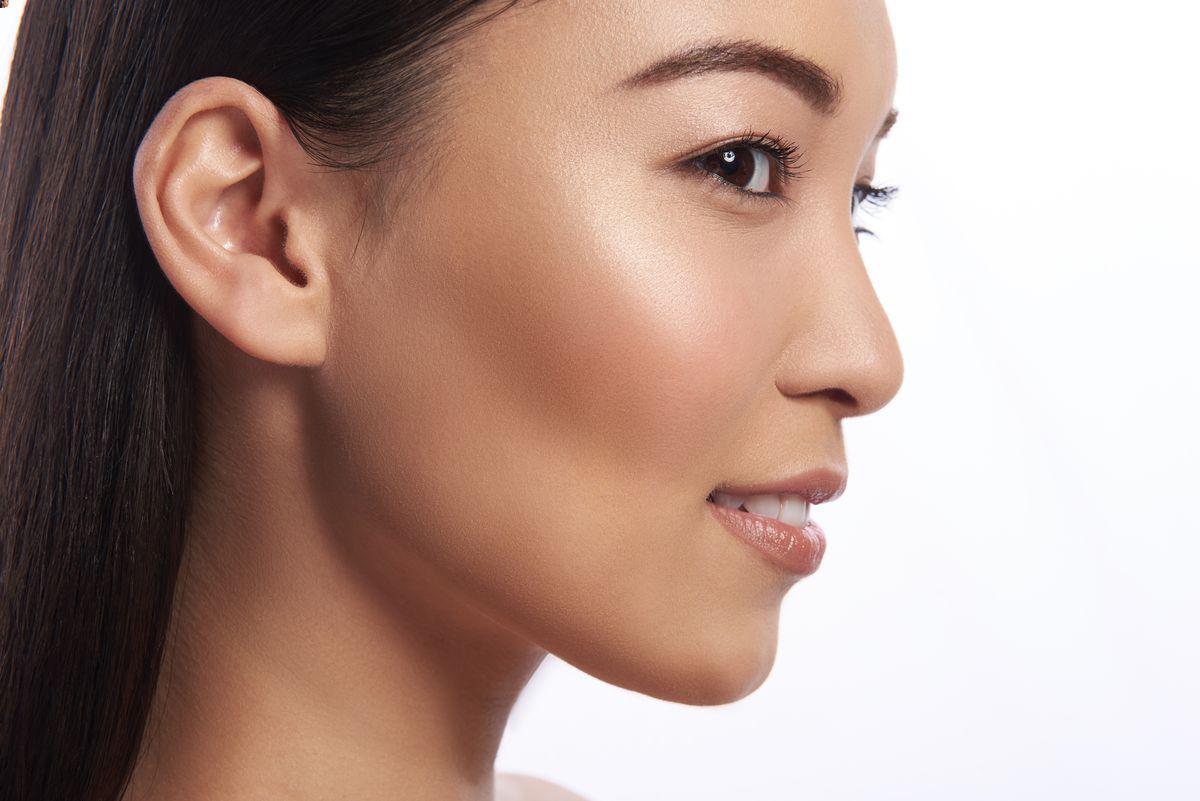 Profile of an Asian woman with brown skin