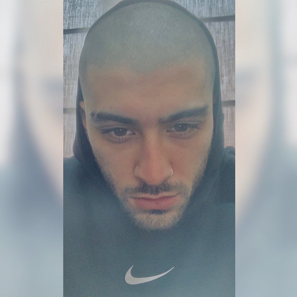 Zayn Malik with buzz cut hairstyle.