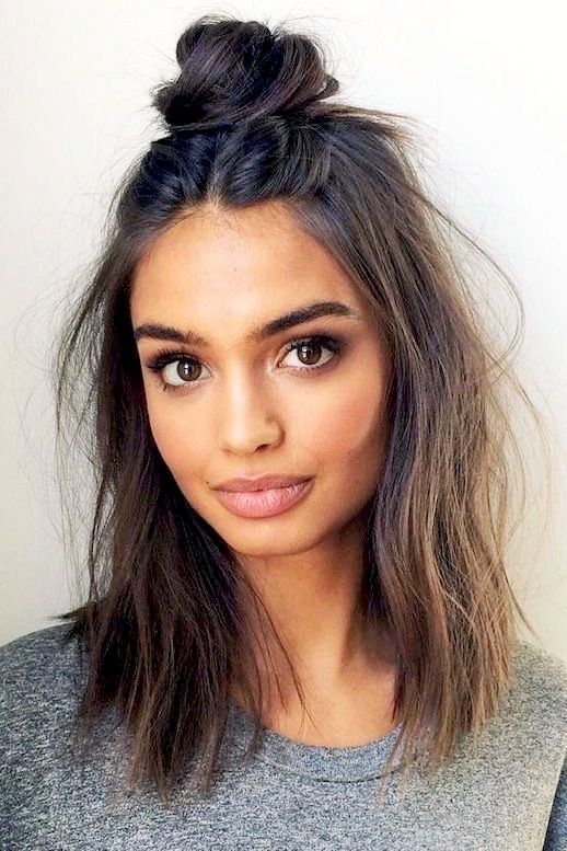 Portrait of a woman with a top knot