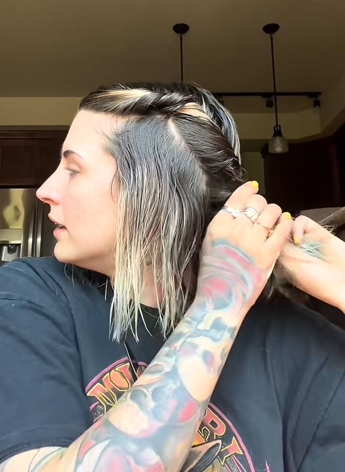 Portrait of a woman twisting her damp hair