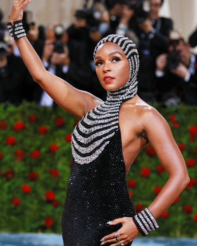 Janelle Monáe in black and white sparkly ensemble at Met Gala red carpet. 