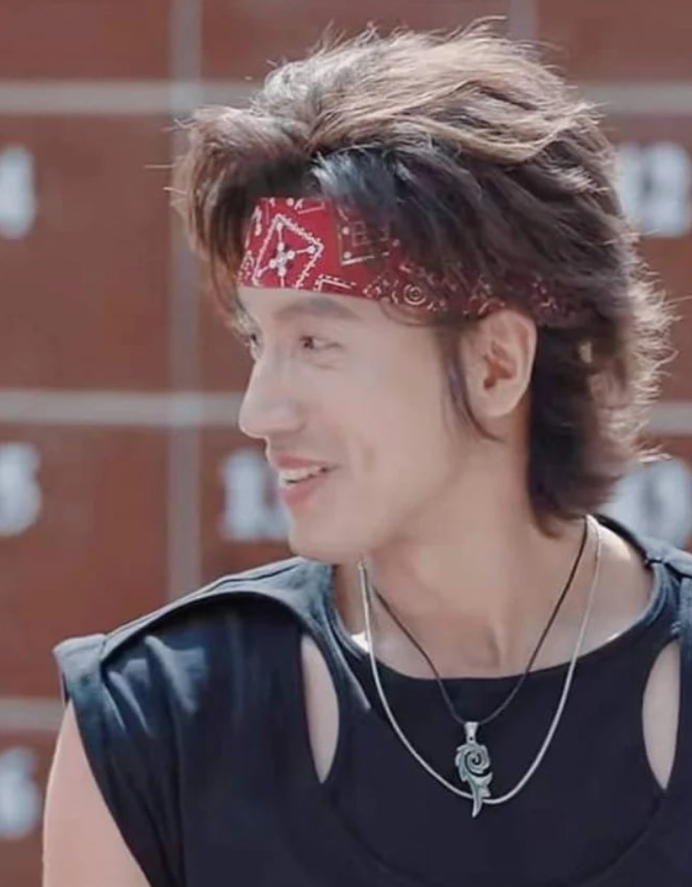 Old photo of Jerry Yan with long shaggy hair and bandana.