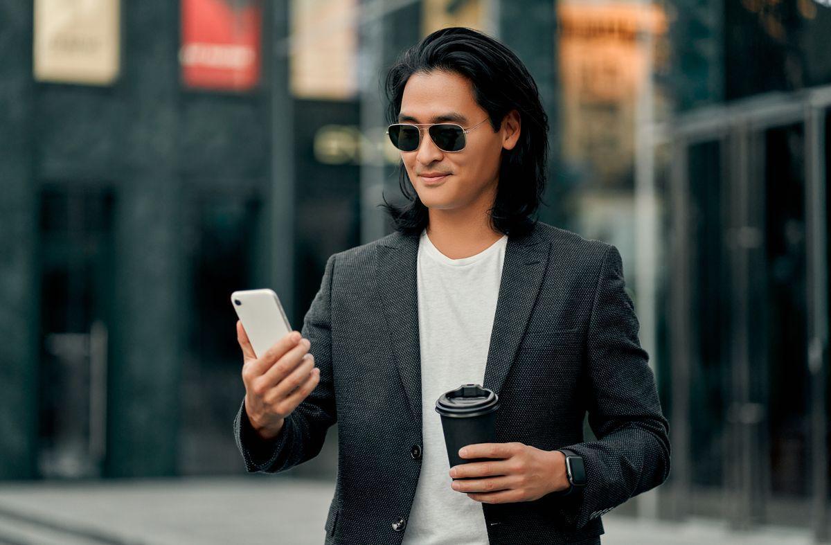 Asian man with shades in suit