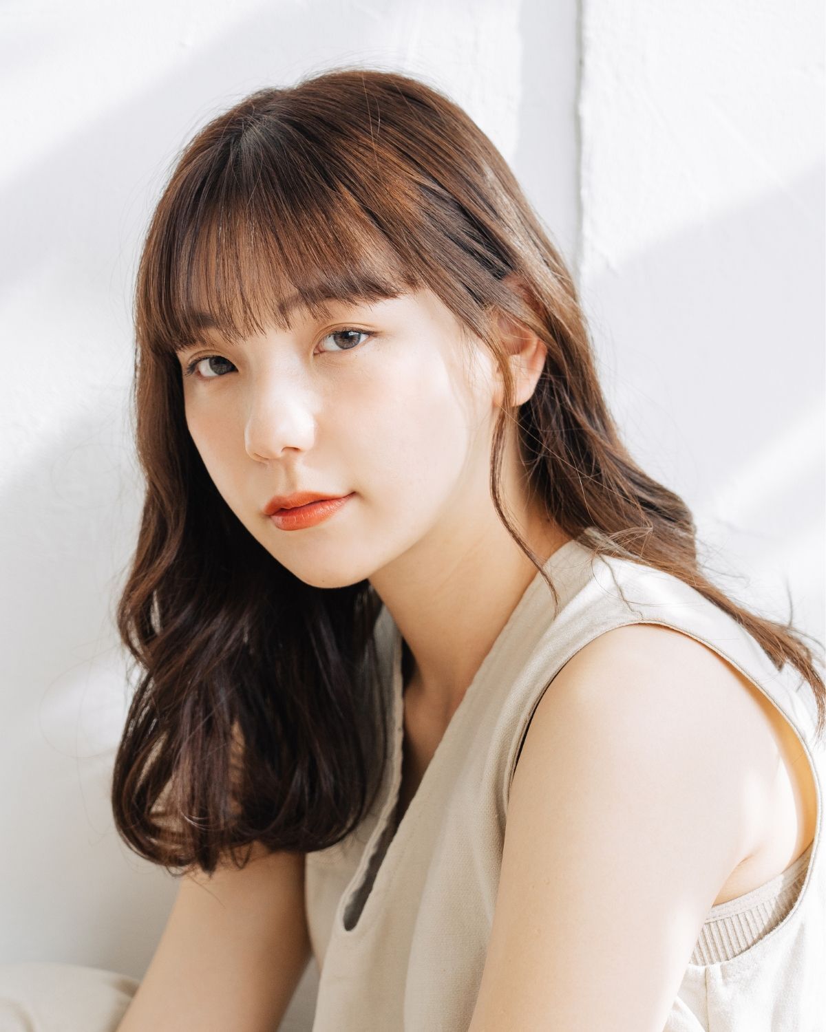 Tóc xoăn lơi mái ngang 