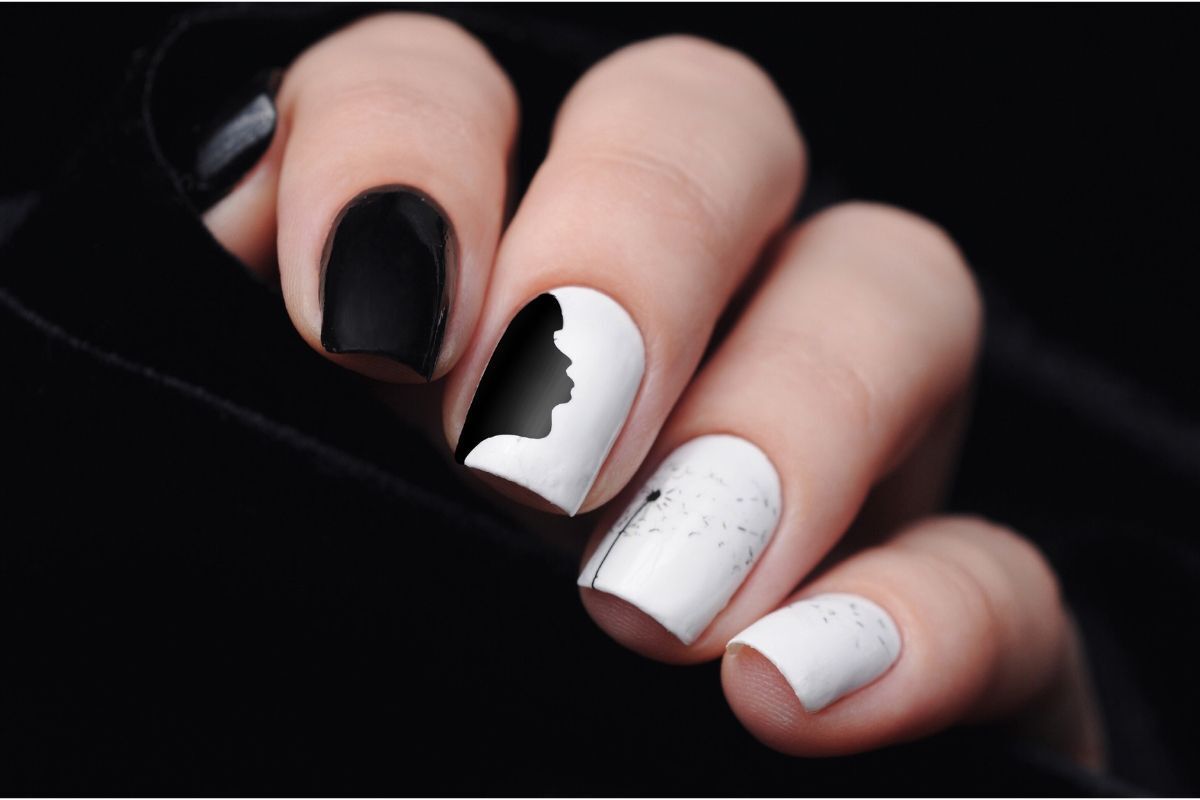 mẫu nail đen trắng cute hình cô gái thôi hoa bồ công anh màu đen trên nền trắng