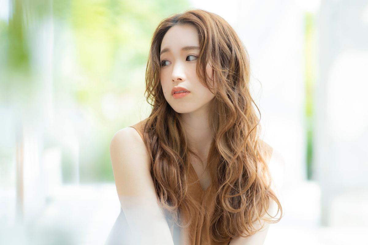 Tóc layer medium length xoăn bung