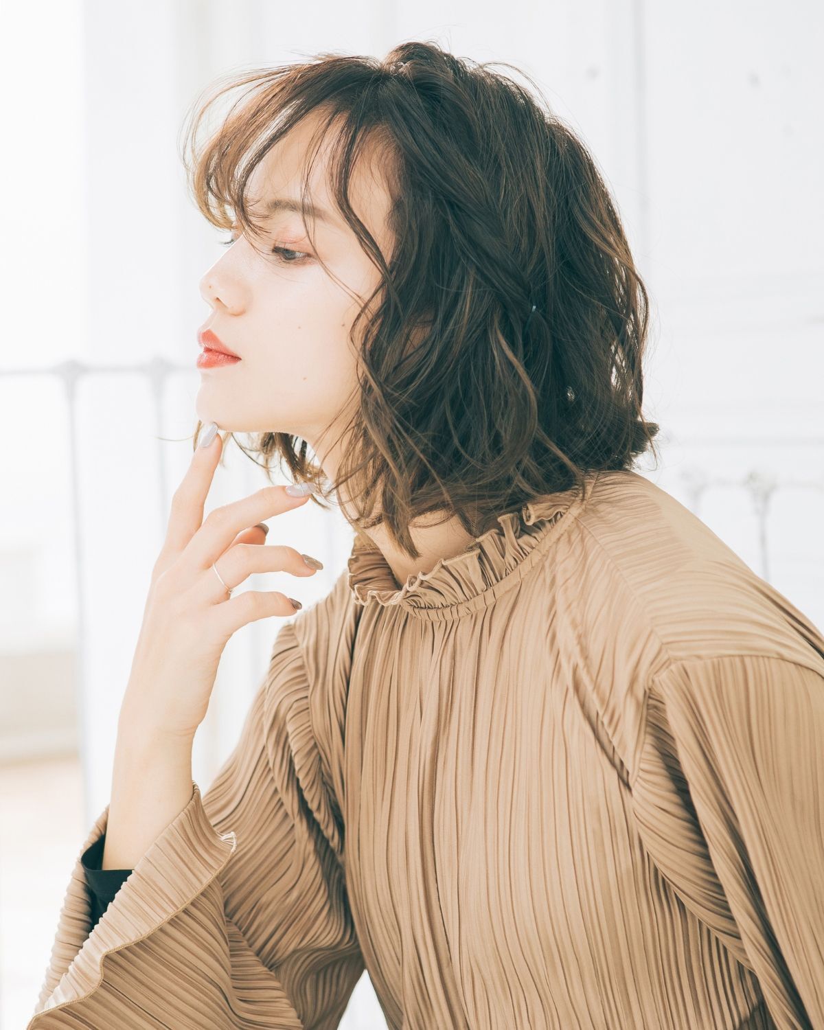 kiểu tóc đi chơi tết tóc ngắn uốn xoăn ngang vai