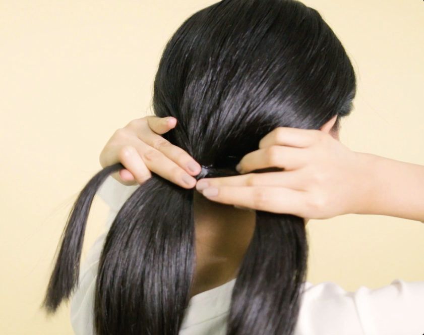 Wanita asia gaya rambut pesta akhir tahun infinity braid