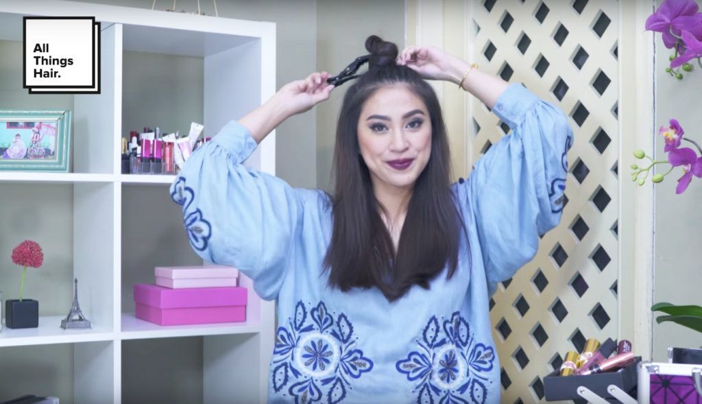 Membuat top knot pada rambut - model rambut festive bold twisted hairstyle