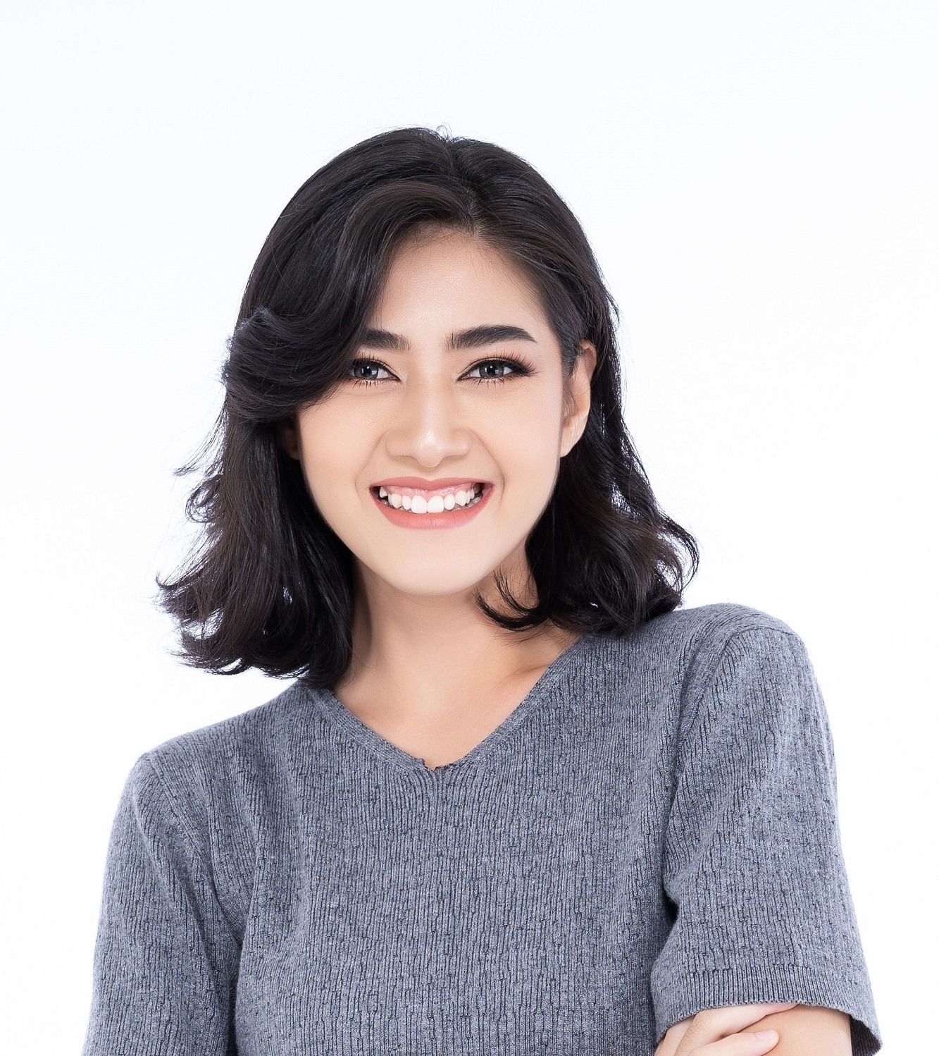 Mencatok ikal bisa jadi trik untuk membuat rambutmu tampak tebal. (Foto: Shutterstock)