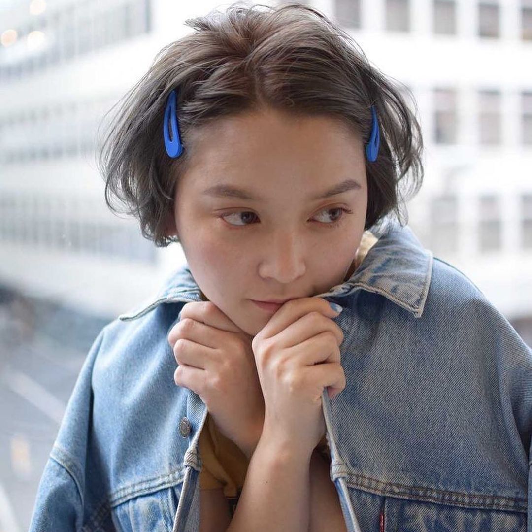 japanese_woman_with_short_pixie_cut_and_hair_clip 