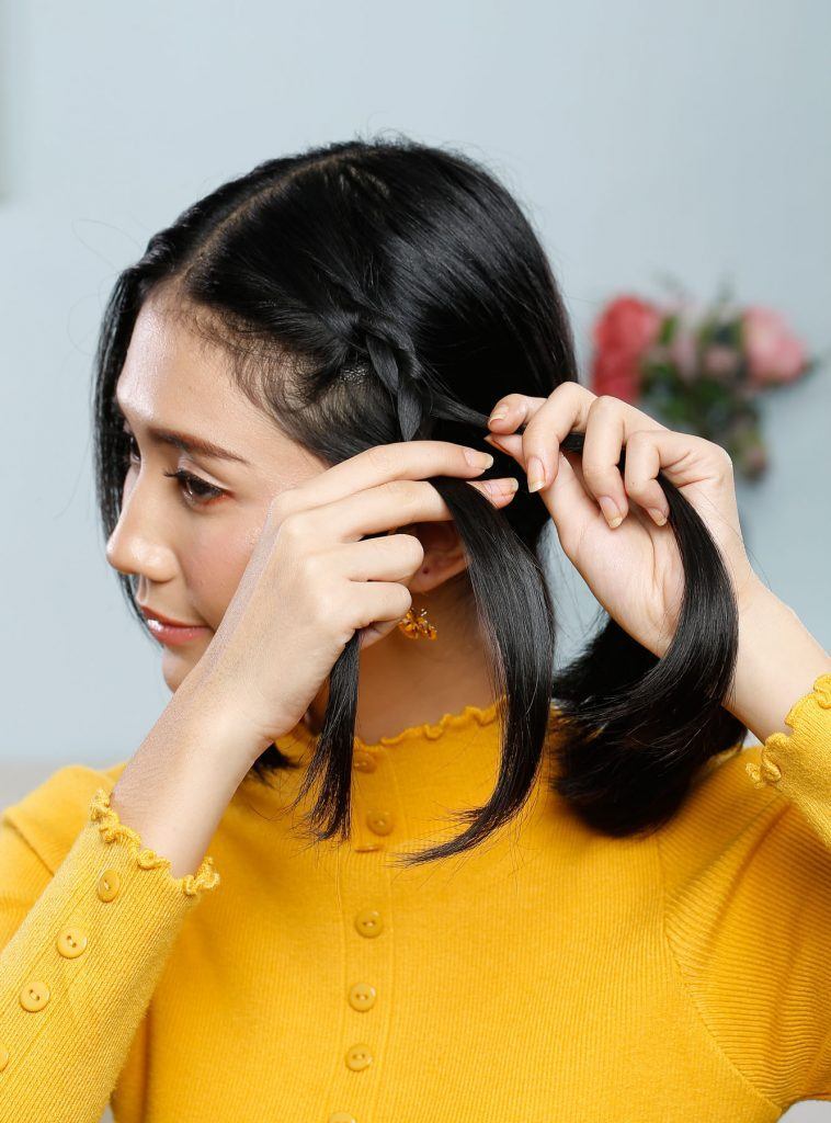 ผู้หญิงเอเชียผมสั้นถักเปีย