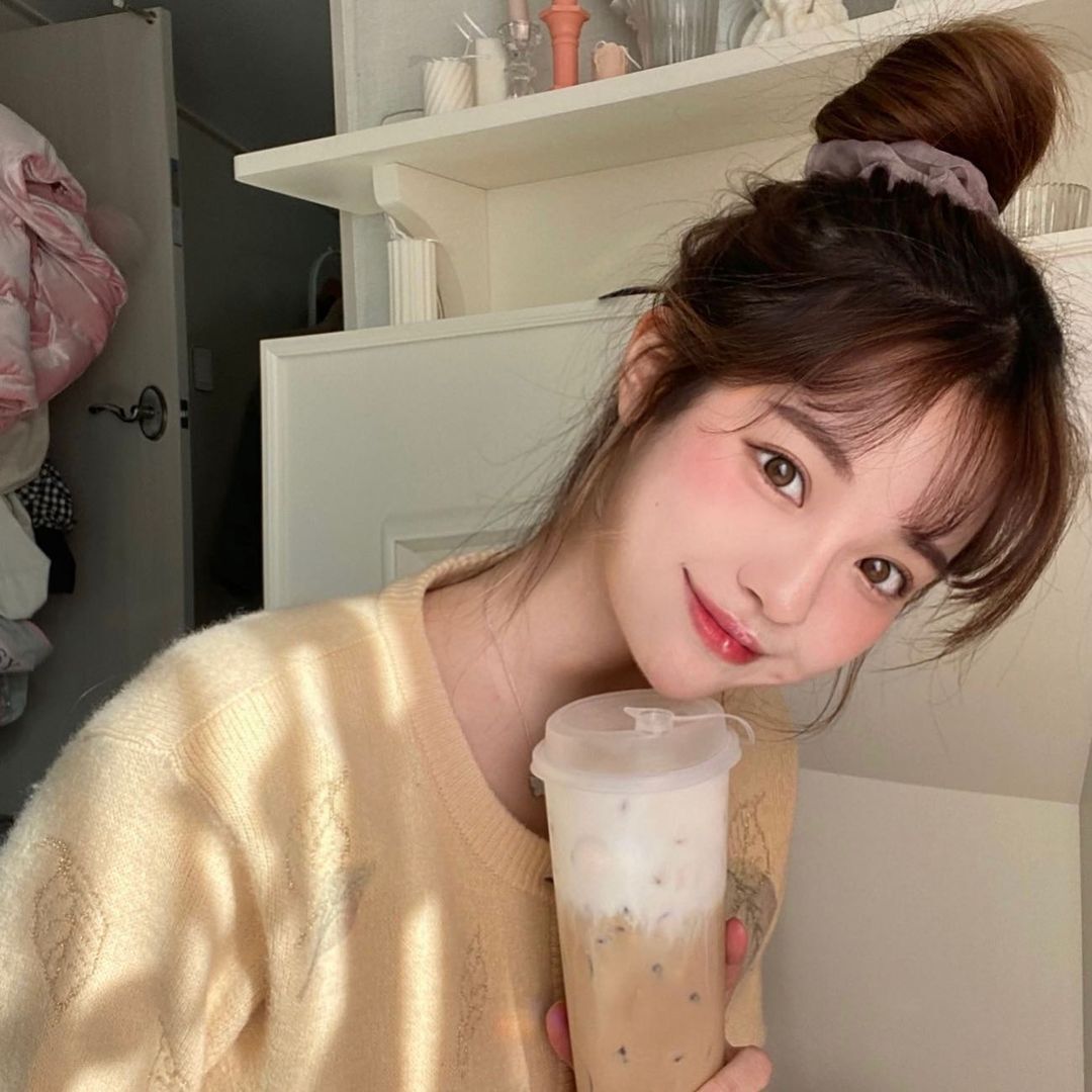 cute_asian_white_model_smile-with_high_bun__see_through_bangs_hairstyle