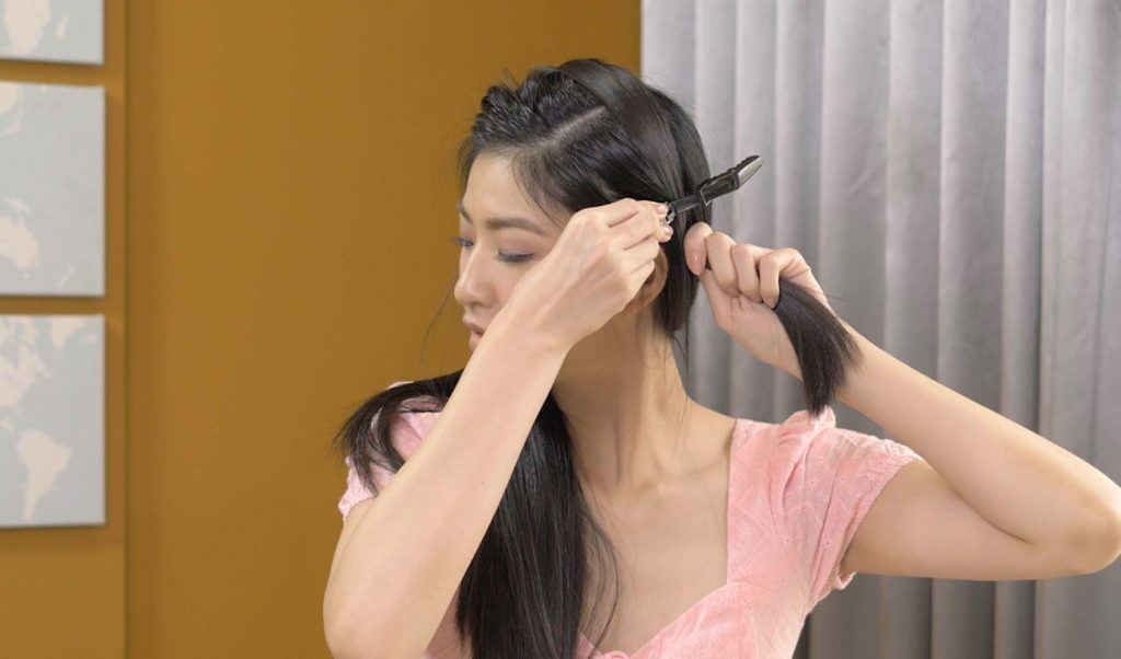 ผู้หญิงเอเชียไว้ผมยาว สีดำ กำลังถักเปีย เปียผมยาว