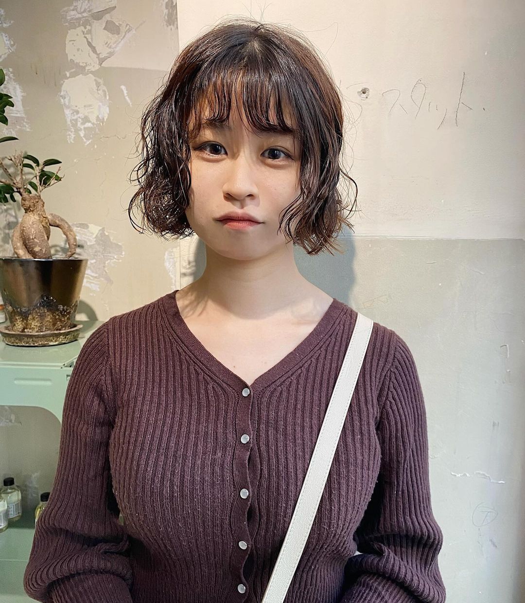 lady_with_short_bob_and_wild_curl_hair_style