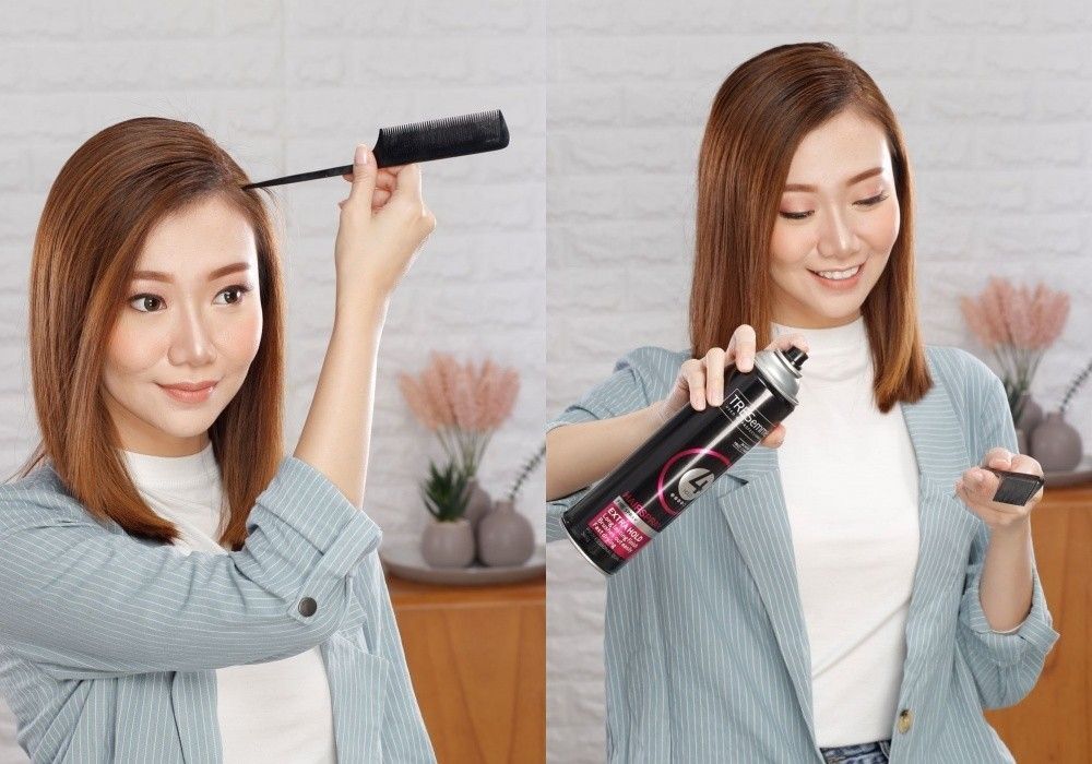 ผู้หญิงเอเชีย ผมยาวประบ่า สีน้ำตาลเข้ม กำลังหวีผม