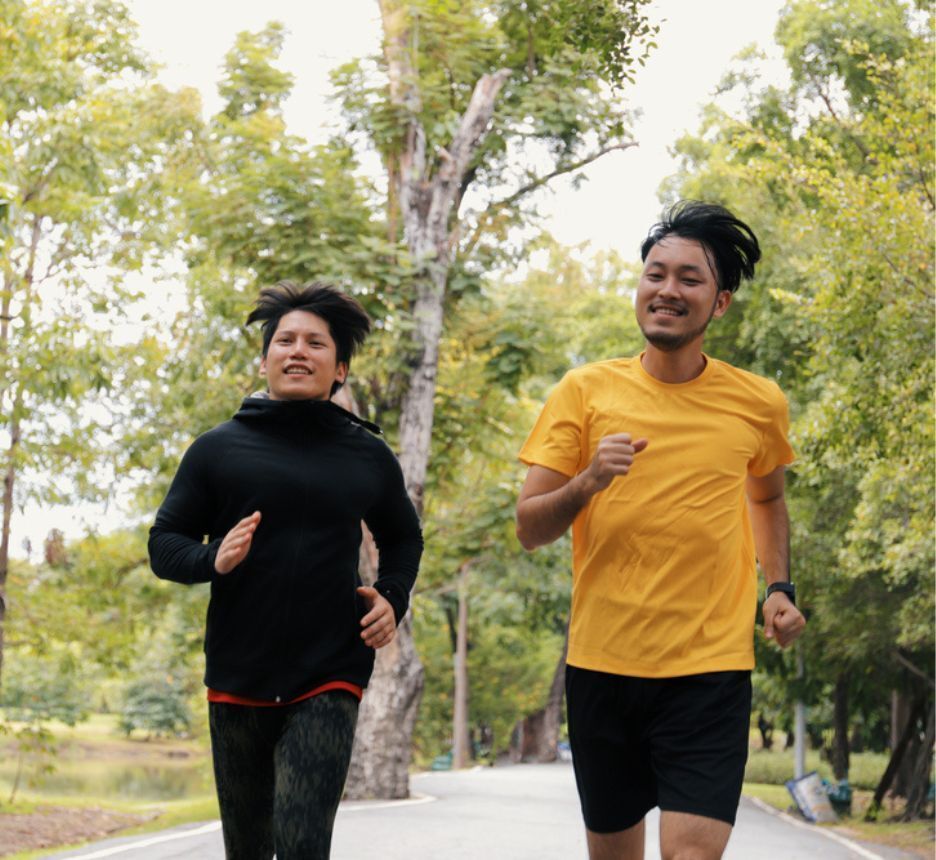 Two men jogging outdoors.