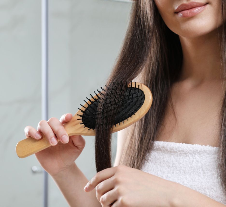 Woman getting a keratin treatment at a salon.