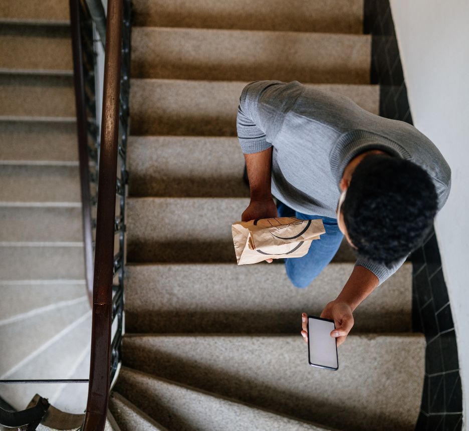 A man climbing up a flight of stairs.