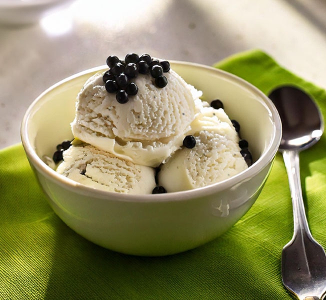 Scoops of Vanilla boba ice cream in a bowl topped with tapioca pearls