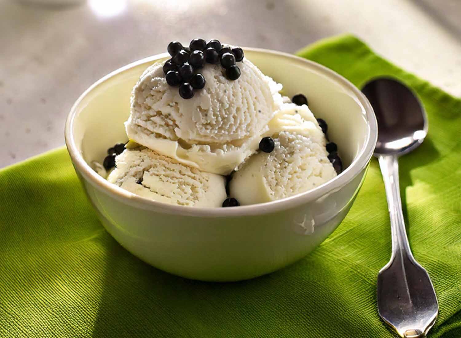 Scoops of Vanilla boba ice cream in a bowl topped with tapioca pearls