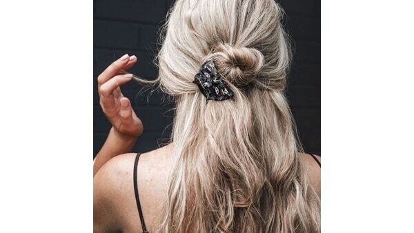 Classic 90s claw clip updo for long hair