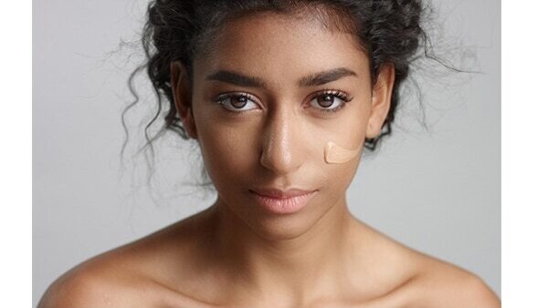 Dab loose powder before applying a concealer
