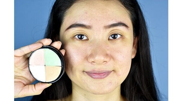 Dab loose powder before applying a concealer