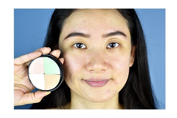 Dab loose powder before applying a concealer
