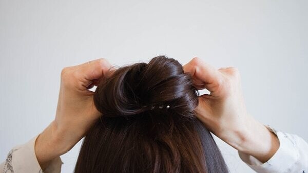 Half bun hairstyle hack: How to cover the bare spots?