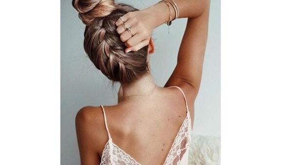 bun hairstyle Bejeweled updos for brides brown hair