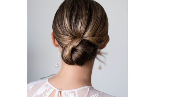 bun hairstyle Bejeweled updos for brides brown hair