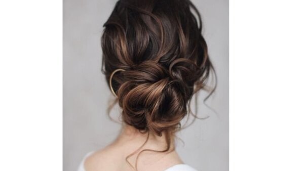 bun hairstyle Bejeweled updos for brides brown hair