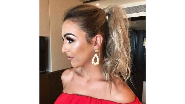 3. Messy top-knot hairstyle
