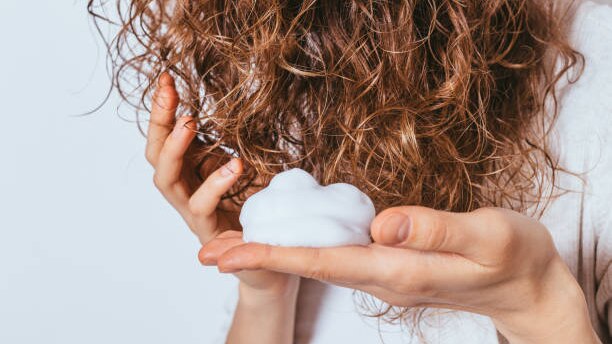 products to add shine to curly hair woman brown long hair