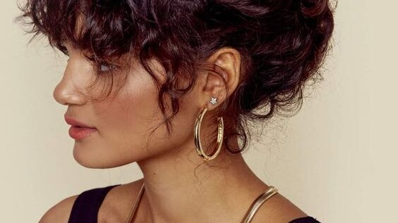retro hairstyle with scarf curls woman long top knot