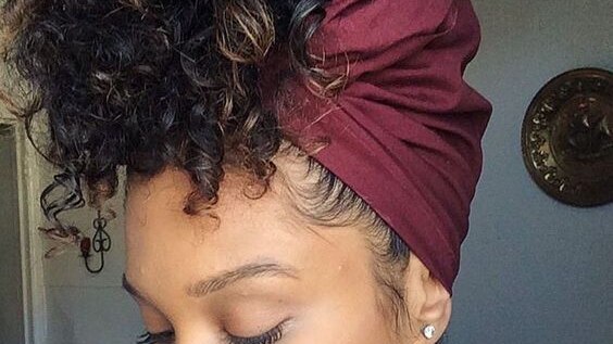 retro hairstyle with scarf curls woman long top knot