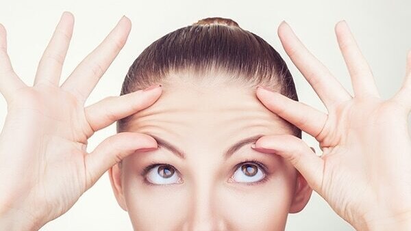 Pull your fingers towards your ear