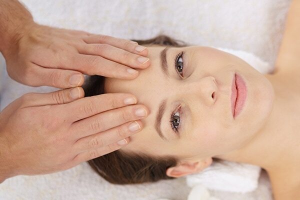 Pull your fingers towards your ear