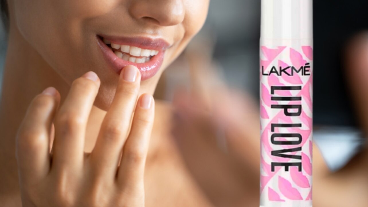 how to make your lips look fuller without makeup woman Dermalogica Age Smart Renewal Lip Complex Lip Balm