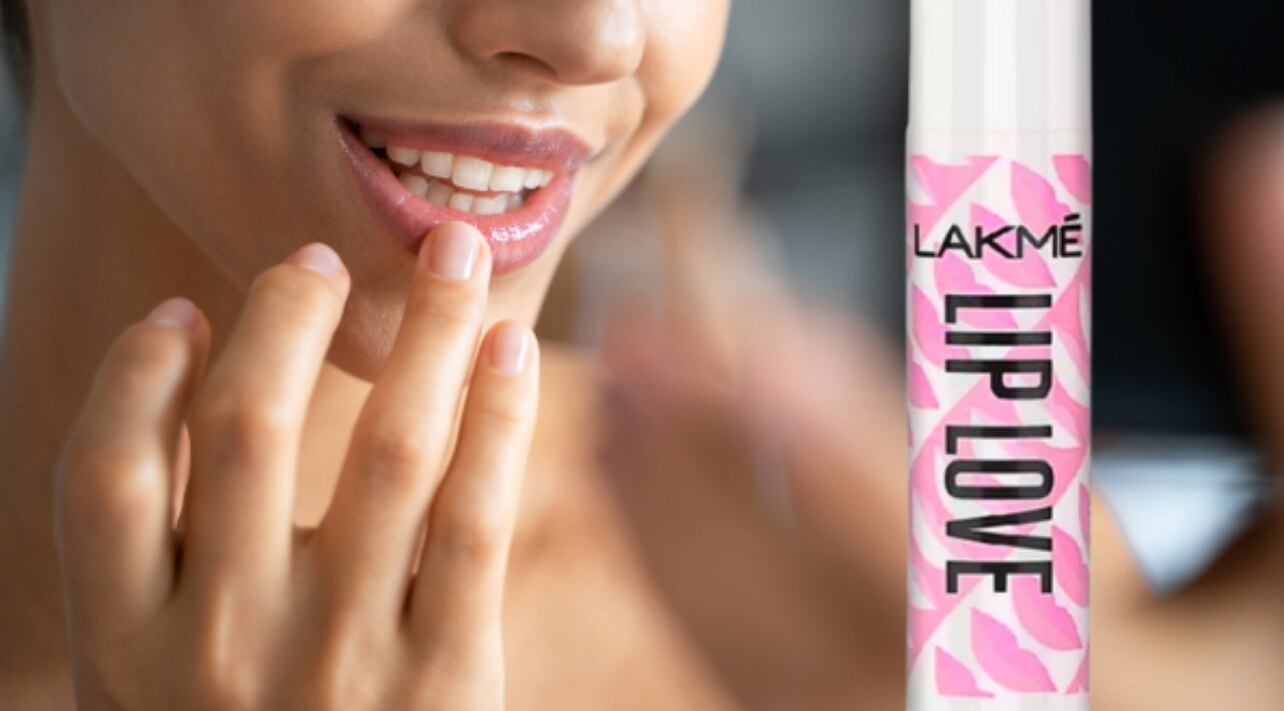 how to make your lips look fuller without makeup woman Dermalogica Age Smart Renewal Lip Complex Lip Balm