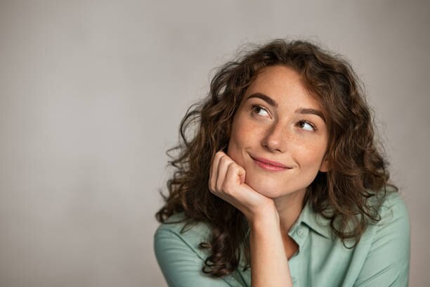 led face mask brunette woman brown curly hair