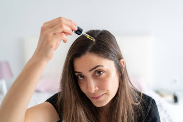 Top Benefits to Using Hair Oil for Hair Growth This Summer woman long brown hair