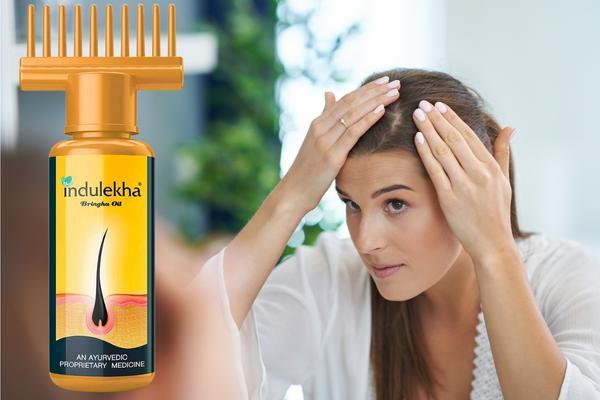 Top Benefits to Using Hair Oil for Hair Growth This Summer woman long brown hair