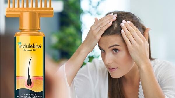 Top Benefits to Using Hair Oil for Hair Growth This Summer woman long brown hair