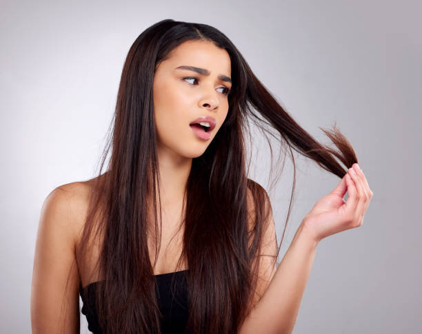 Top Benefits to Using Hair Oil for Hair Growth This Summer woman long brown hair