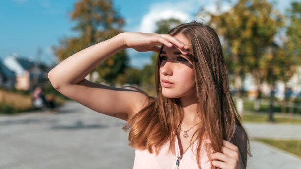 Top Benefits to Using Hair Oil for Hair Growth This Summer woman long brown hair